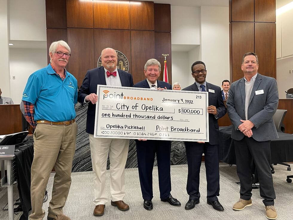 From left: Jim Young, President of the Opelika Pickleball Club, Sam Bailey, Director of...