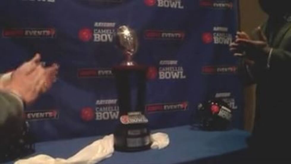 The unveiling of the Raycom Media Camellia Bowl trophy. (Source: WSFA)