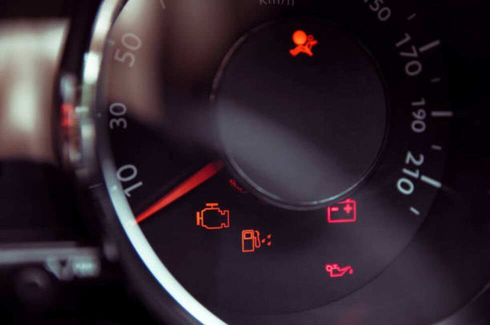 Many different car dashboard lights in closeup