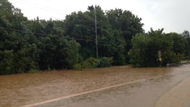 Flooding near North Uniroyal Road in Opelika (Source: WTVM/Annie Hubbell)