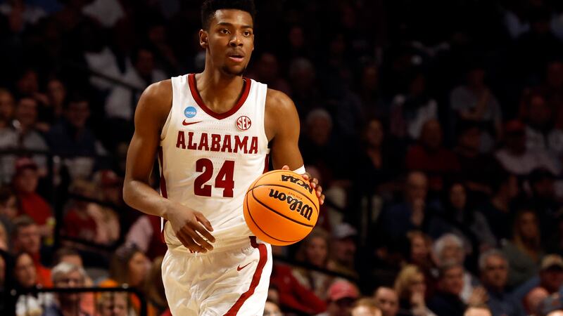 Alabama forward Brandon Miller dribbles in the first half of a second-round college basketball...