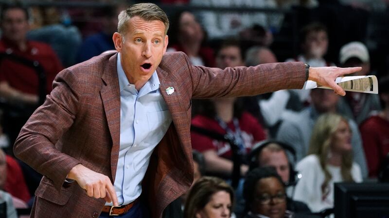 Alabama coach Nate Oats calls out to the team during the first half of a second-round college...