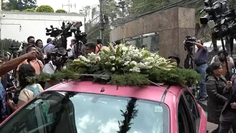 People gather at the funeral home where the body of the Xavier Lopez is being prepared for the...