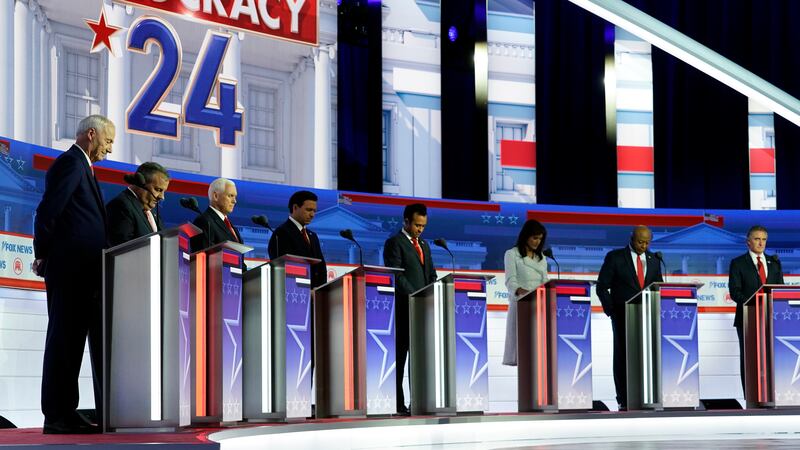 FILE - Republican presidential candidates, from left, former Arkansas Gov. Asa Hutchinson,...