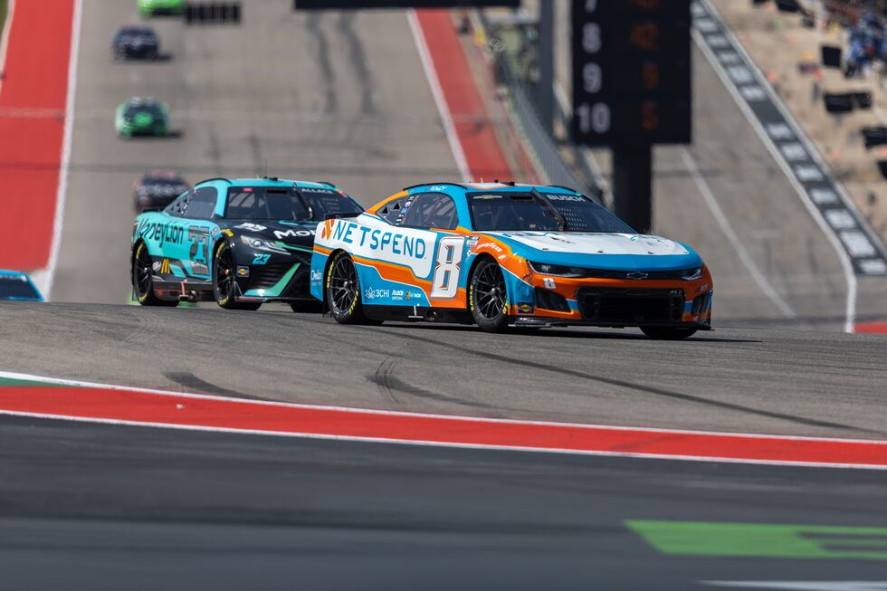 Bubba Wallace (23) and Kyle Busch (8) steer out of Turn 1 during a NASCAR Cup Series auto race...