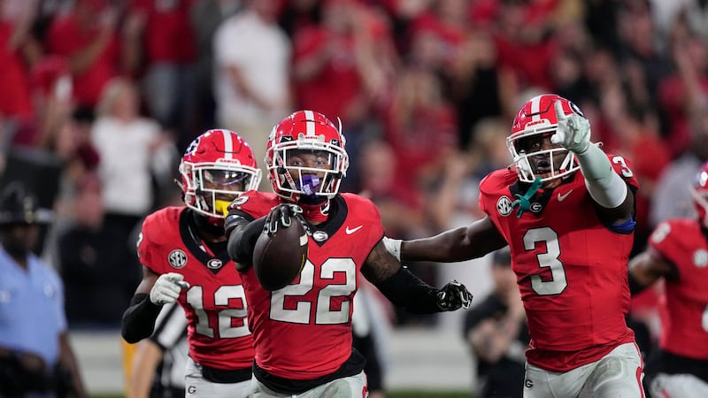 Georgia defensive back Javon Bullard (22) celebrates with Kamari Lassiter (3) and Julian...