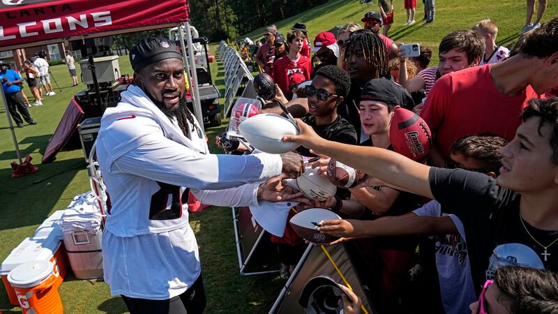 Atlanta Falcons running back Cordarrelle Patterson signs autographs for fans during the team's...