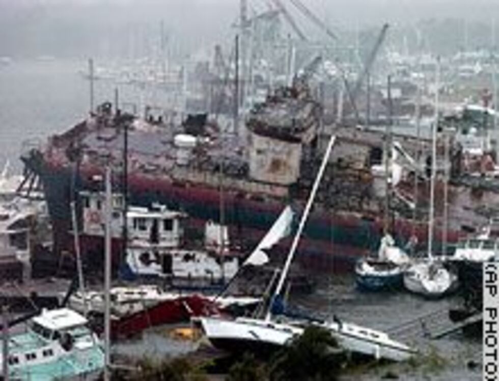 Large tanker amongst smaller boats in marina at Pensacola, FL