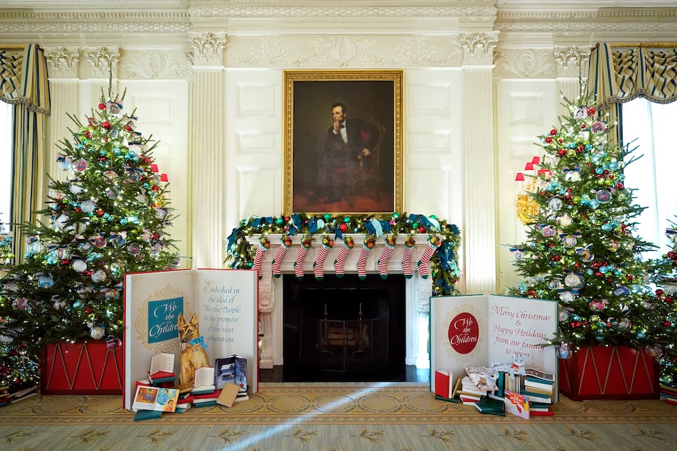 The State Dining Room of the White House is decorated for the holiday season during a press...