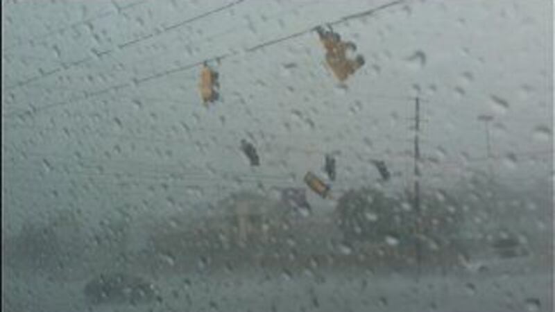 A viewer captured video of a traffic light breaking loose from power lines, then falling to...